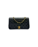 Sac à bandoulière Mademoiselle Médium en cuir lisse noir et doré - Chanel
