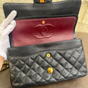Sac à bandoulière Timeless 11.12 en cuir caviar noir - Chanel