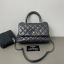 Sac à bandoulière Coco Handle en cuir caviar noir - Chanel
