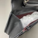 Sac à bandoulière Wallet On Chain en cuir lisse noir - Chanel