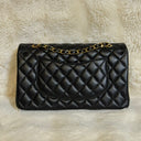 Sac à bandoulière Timeless 25 en cuir lisse noir - Chanel