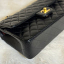 Sac à bandoulière Timeless 25 en cuir lisse noir - Chanel