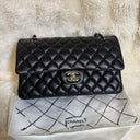 Sac à bandoulière Timeless 25 en cuir lisse noir - Chanel