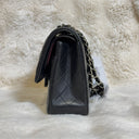 Sac à bandoulière Timeless 25 en cuir lisse noir - Chanel