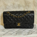 Sac à bandoulière Timeless 25 en cuir caviar noir - Chanel