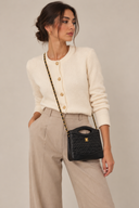 Sac à bandoulière 31 vintage en cuir lisse noir et doré - Chanel
