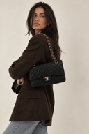 Sac à bandoulière Timeless 11.12 en cuir caviar noir - Chanel